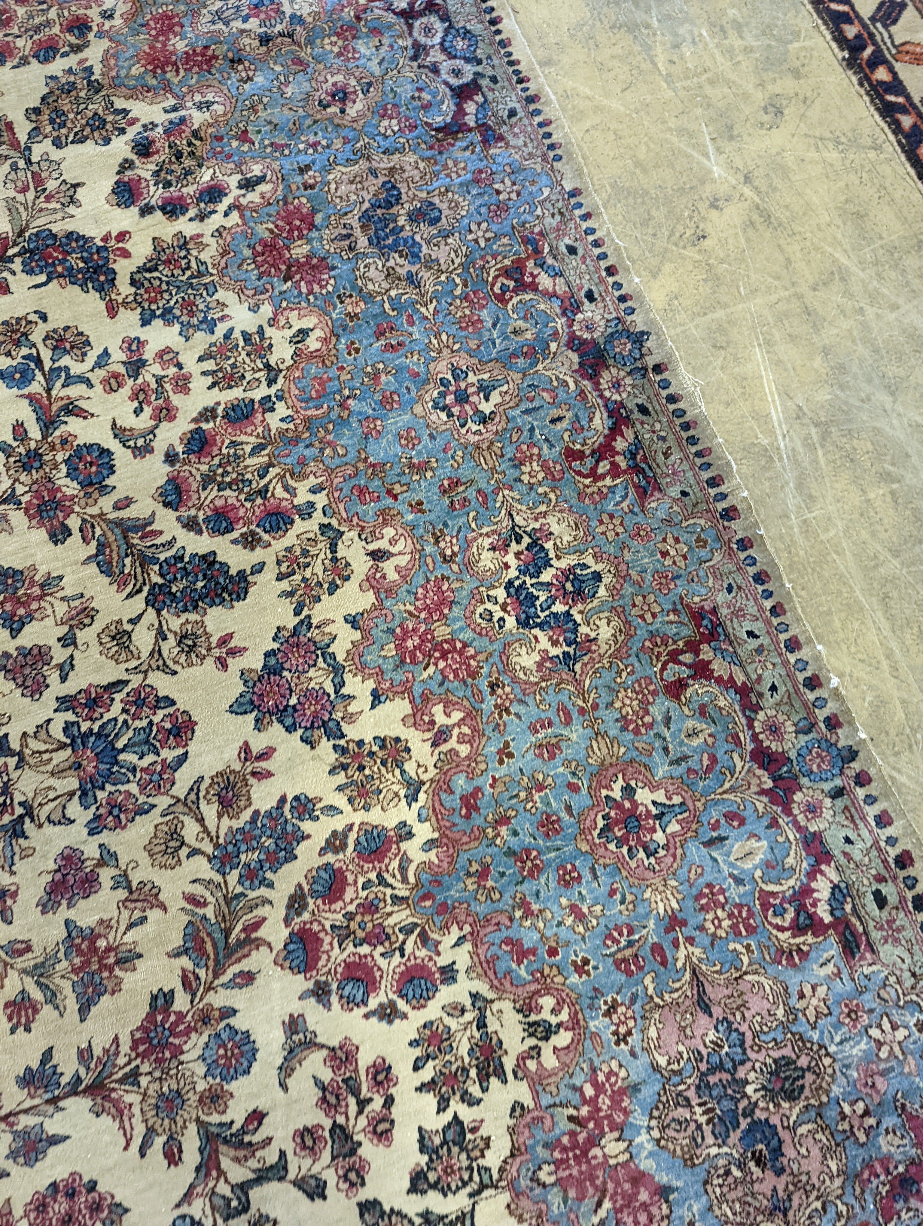 A North West Persian ivory ground carpet, 396 x 290cm